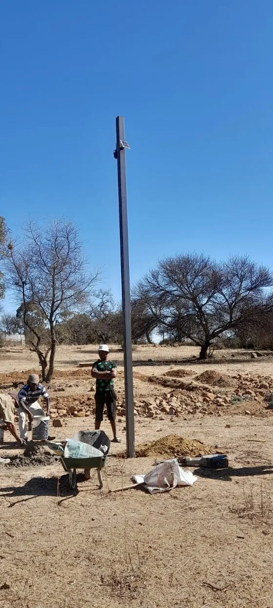 Work in progress around the base of a tall camera pole.