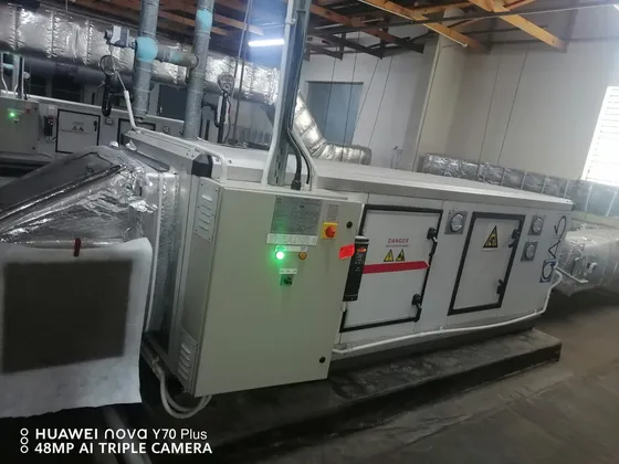 An alternative view of the air-handling cabinet and connected overhead ductwork.