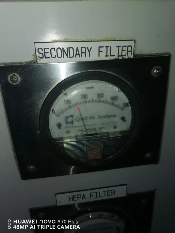 Gauges fitted beside the secondary and HEPA filter sections of an air-handling unit.