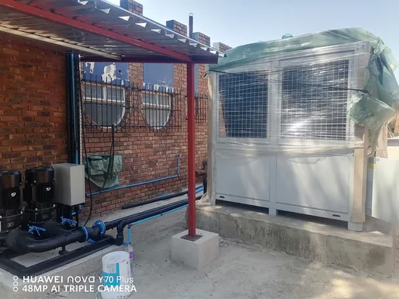 Outdoor cooling equipment and connected pumps and pipework during installation.
