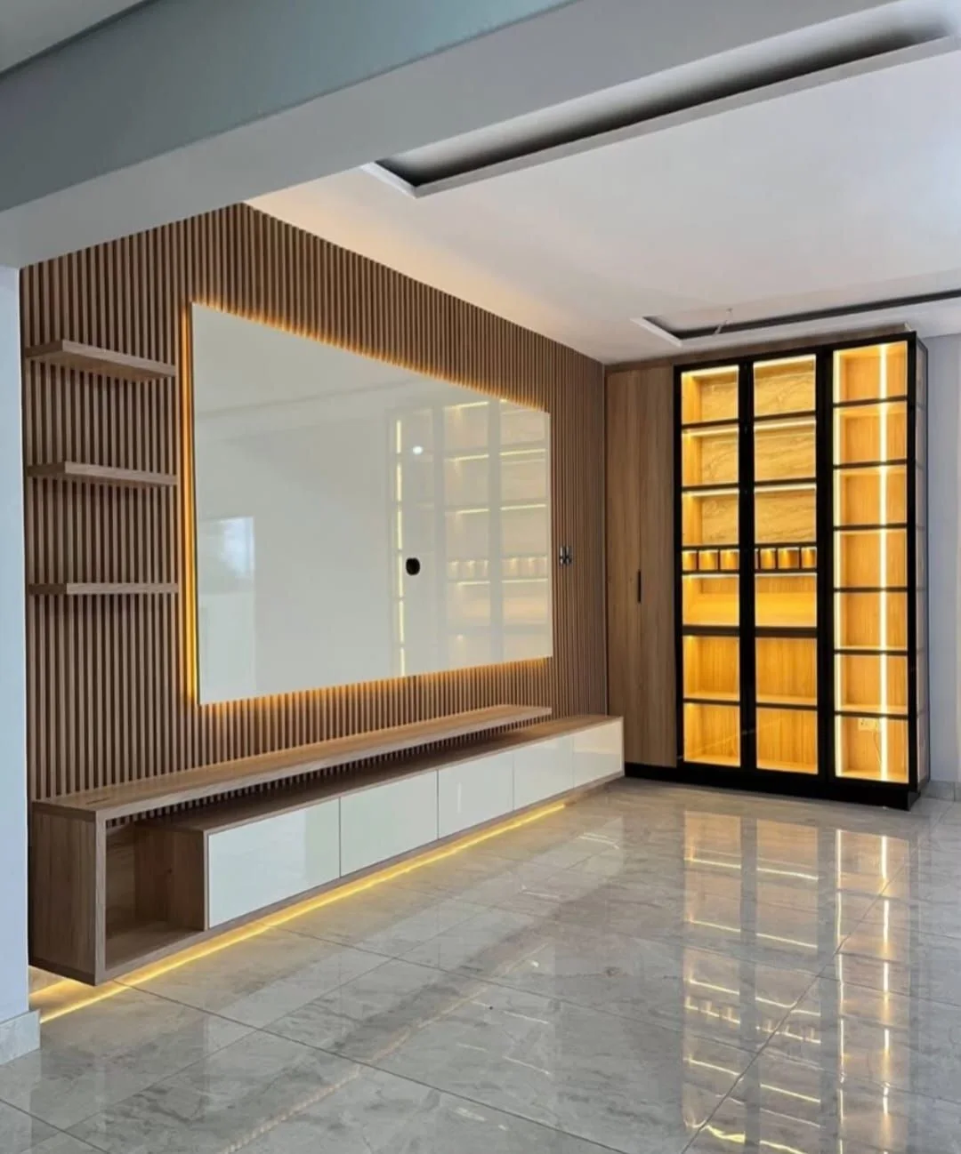 Illuminated feature wall with timber slats and glass display cabinets