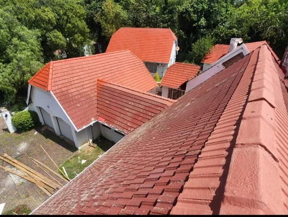 Red tiled roof sections photographed from an elevated position.